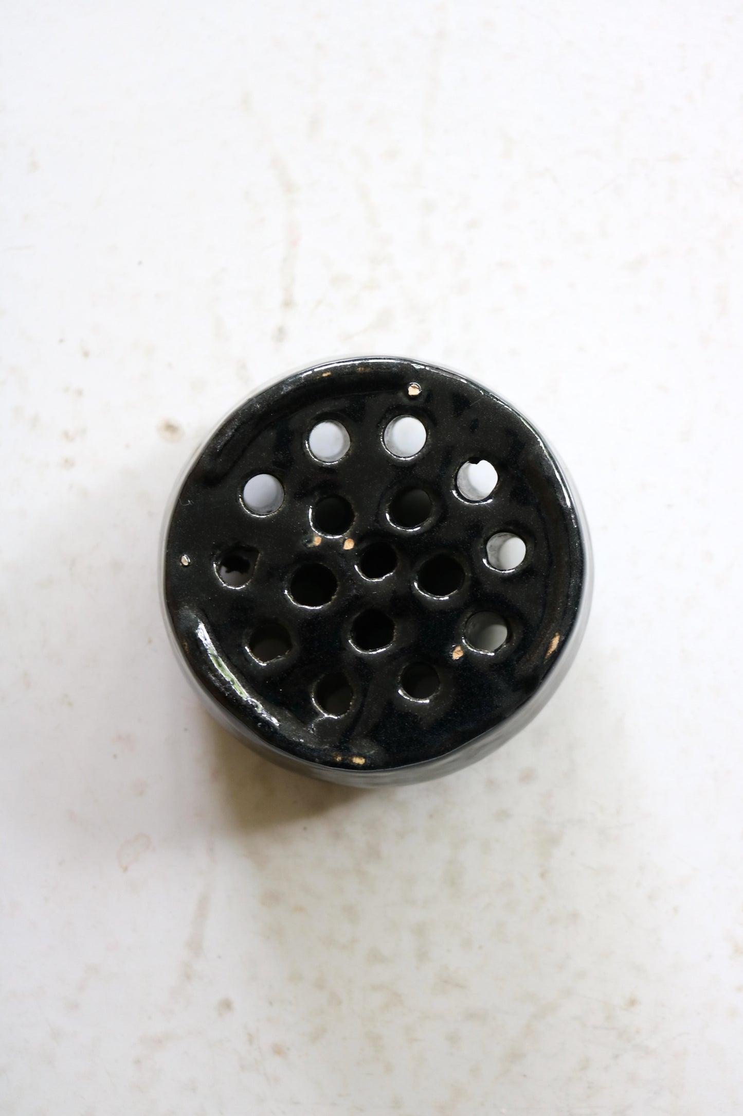 vintage black glazed ceramic flower frog