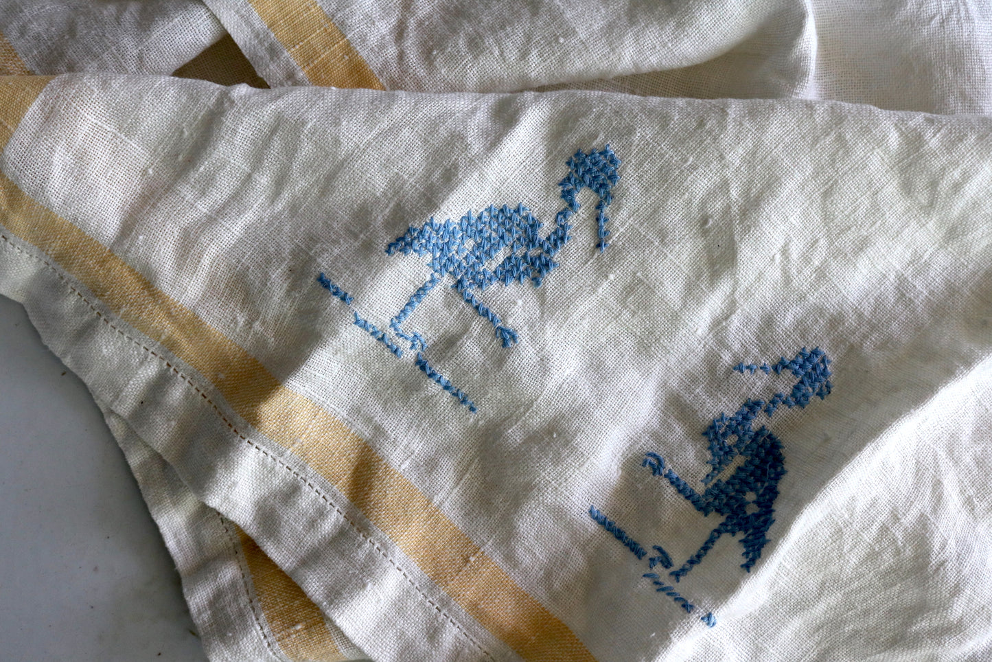 vintage cross stitched linen towel with blue birds