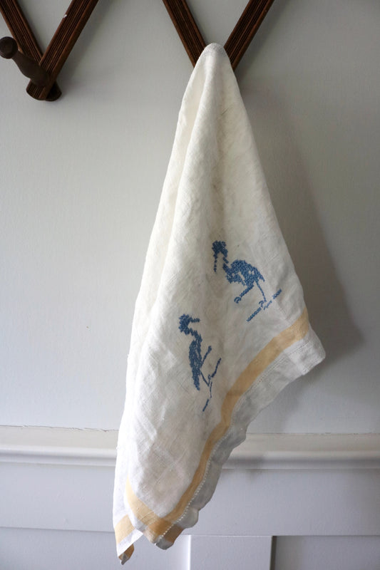 vintage cross stitched linen towel with blue birds
