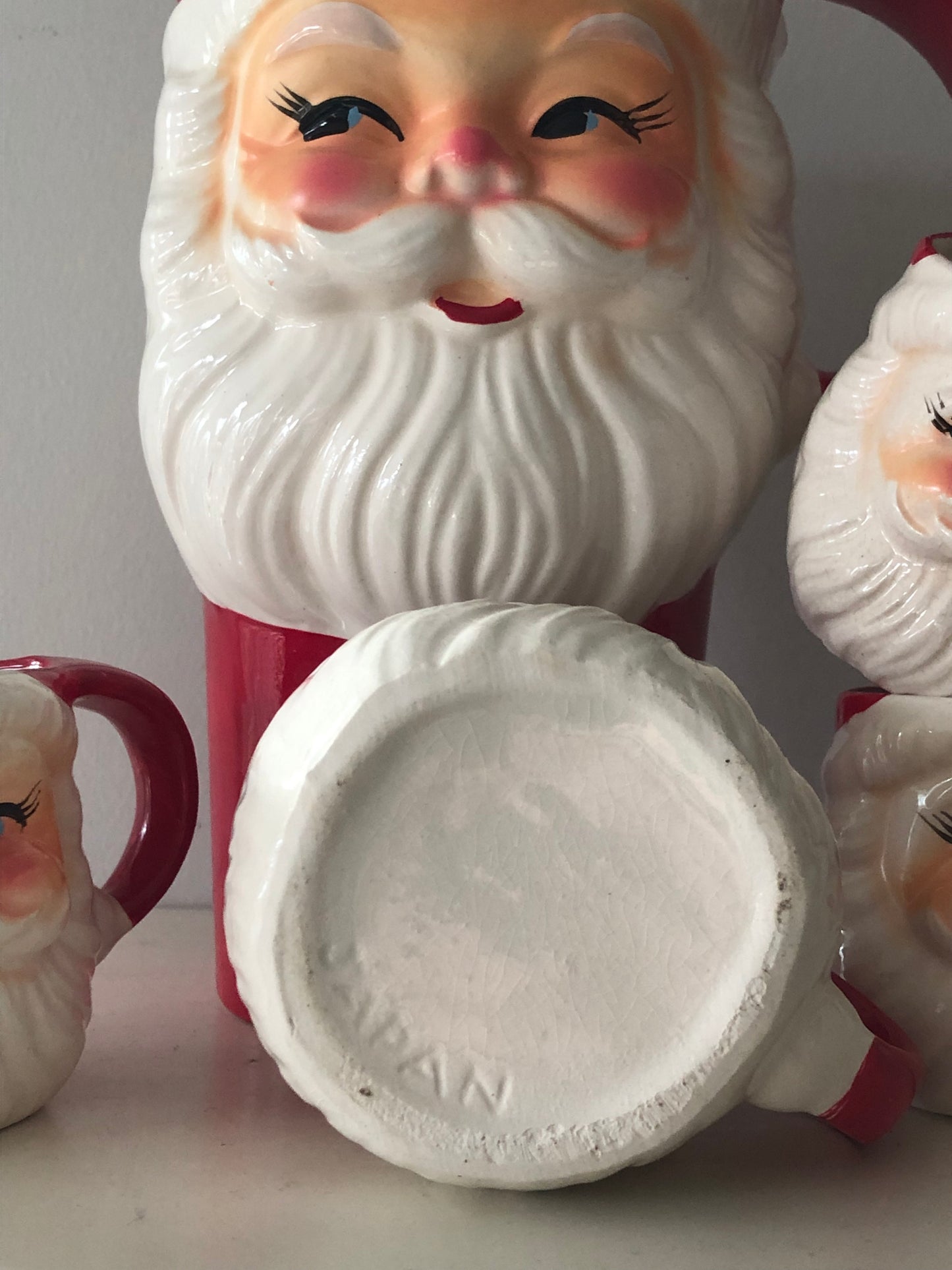 A charming vintage Santa mugs and jug
