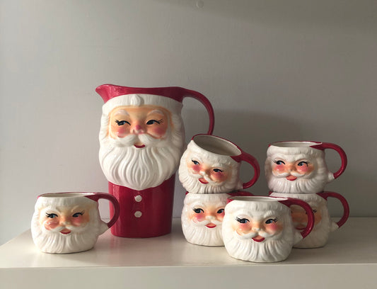 A charming vintage Santa mugs and jug