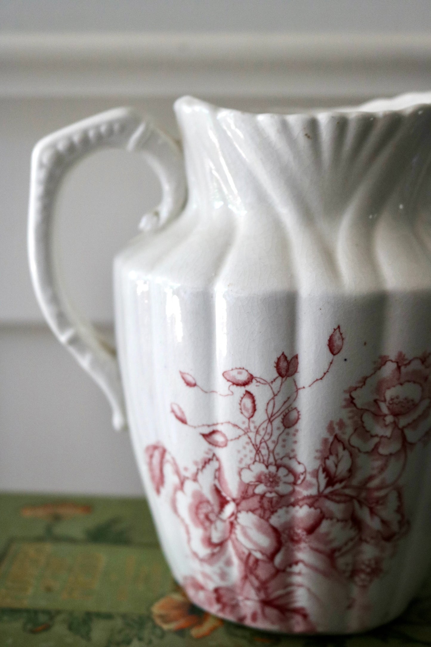 Antique cranberry transferware on white ironstone pitcher