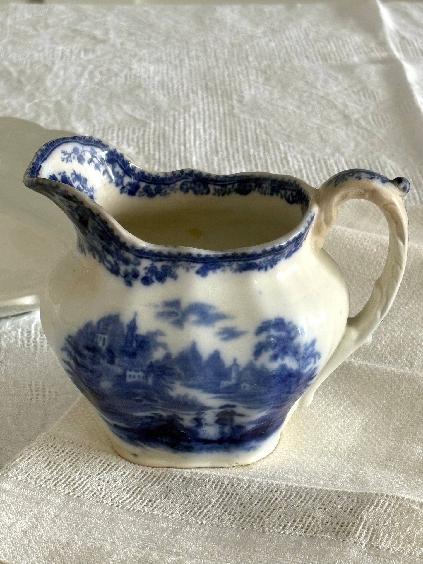 antique late 19th Century Flow Blue transferware pitcher "Non Pareil" pattern