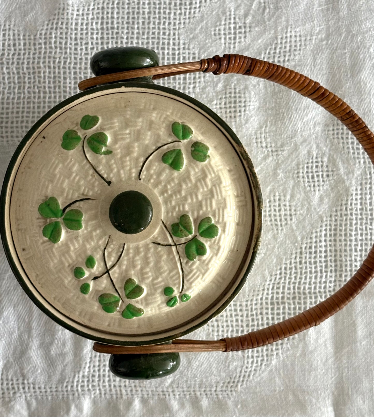 vintage ceramic biscuit jar with rattan handle and Shamrock design