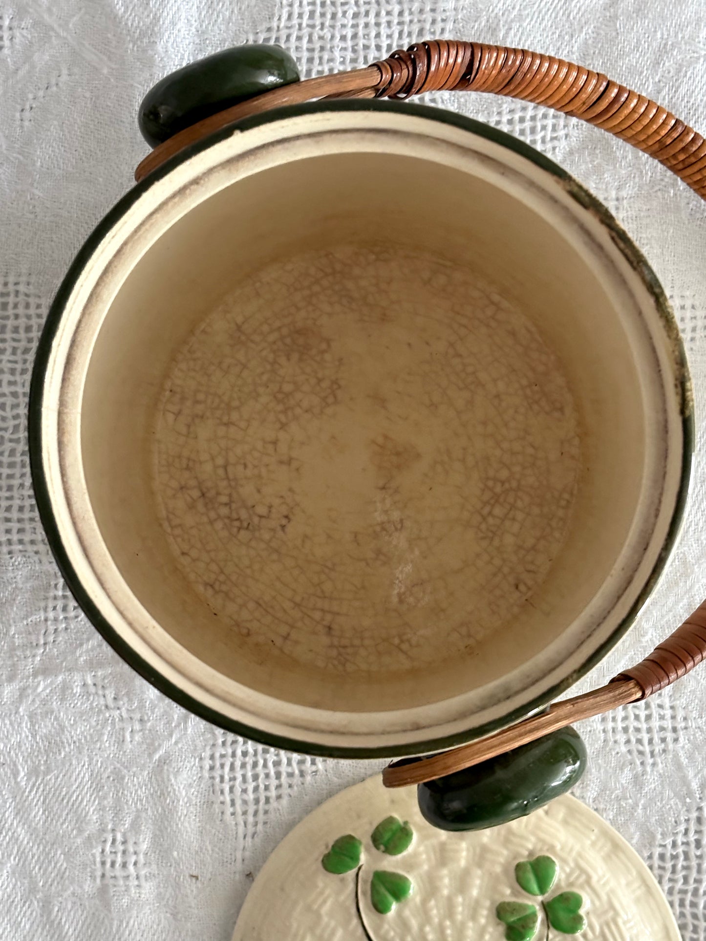 vintage ceramic biscuit jar with rattan handle and Shamrock design