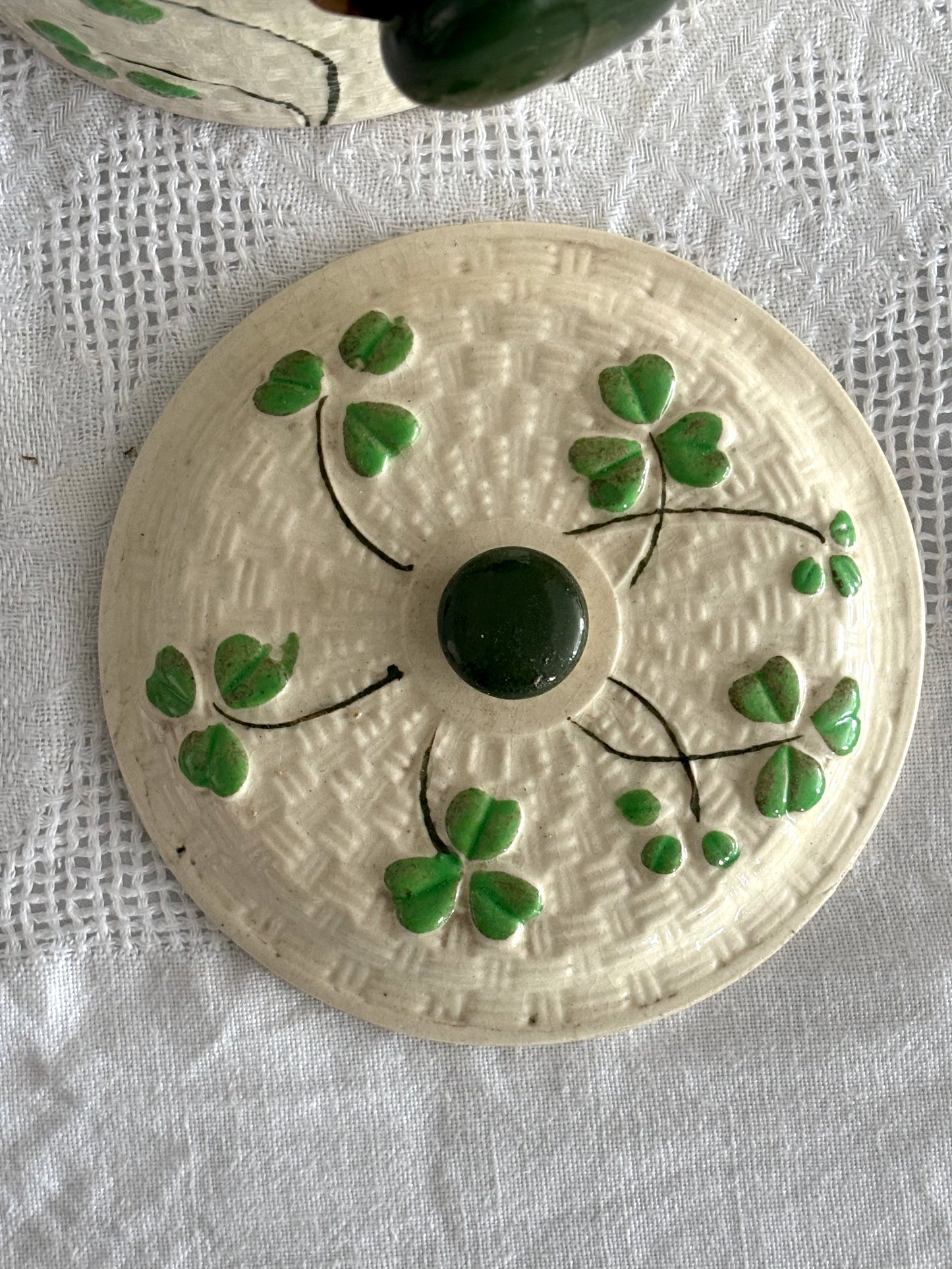 vintage ceramic biscuit jar with rattan handle and Shamrock design