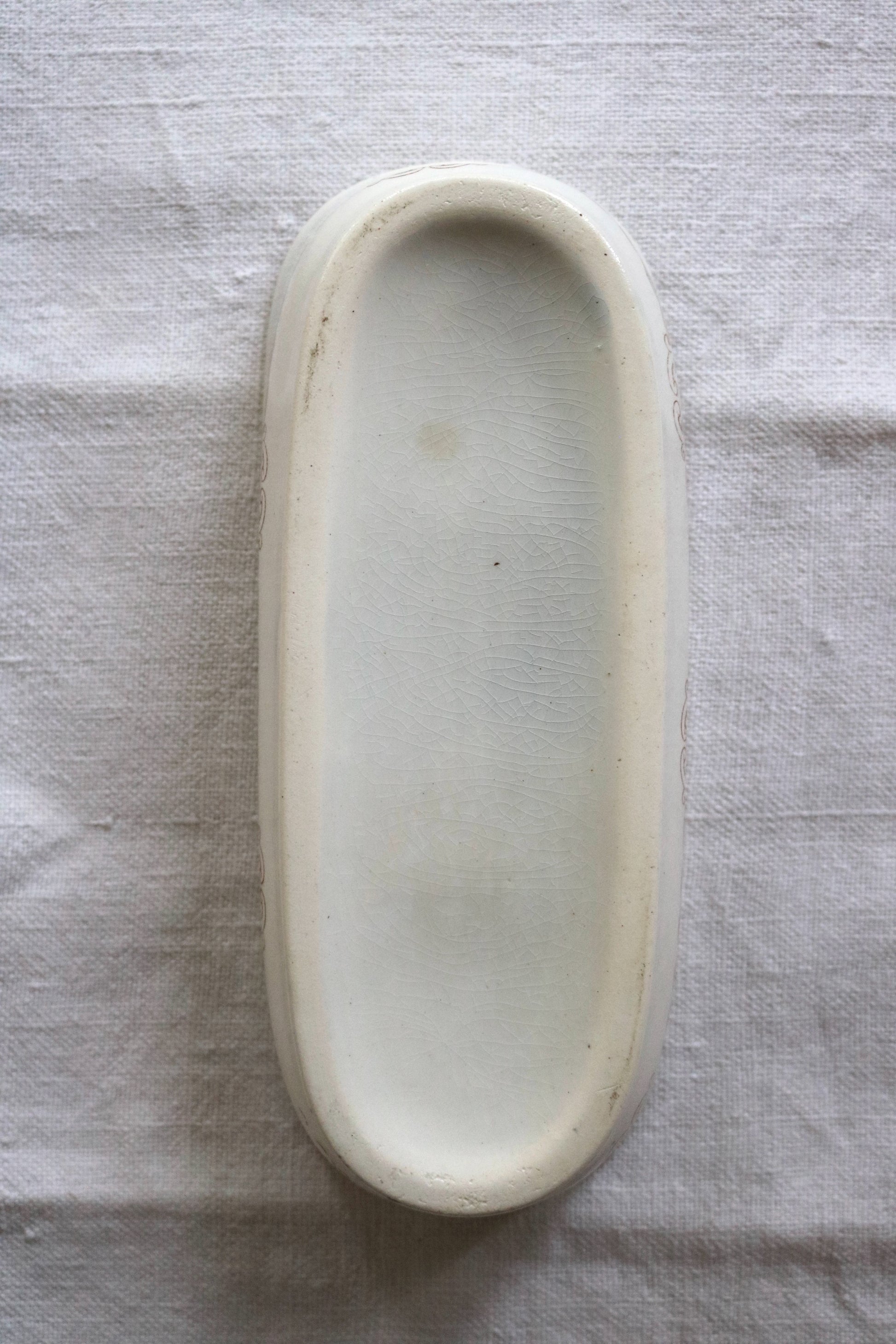 bottom of a antique Victorian ironstone toothbrush dish