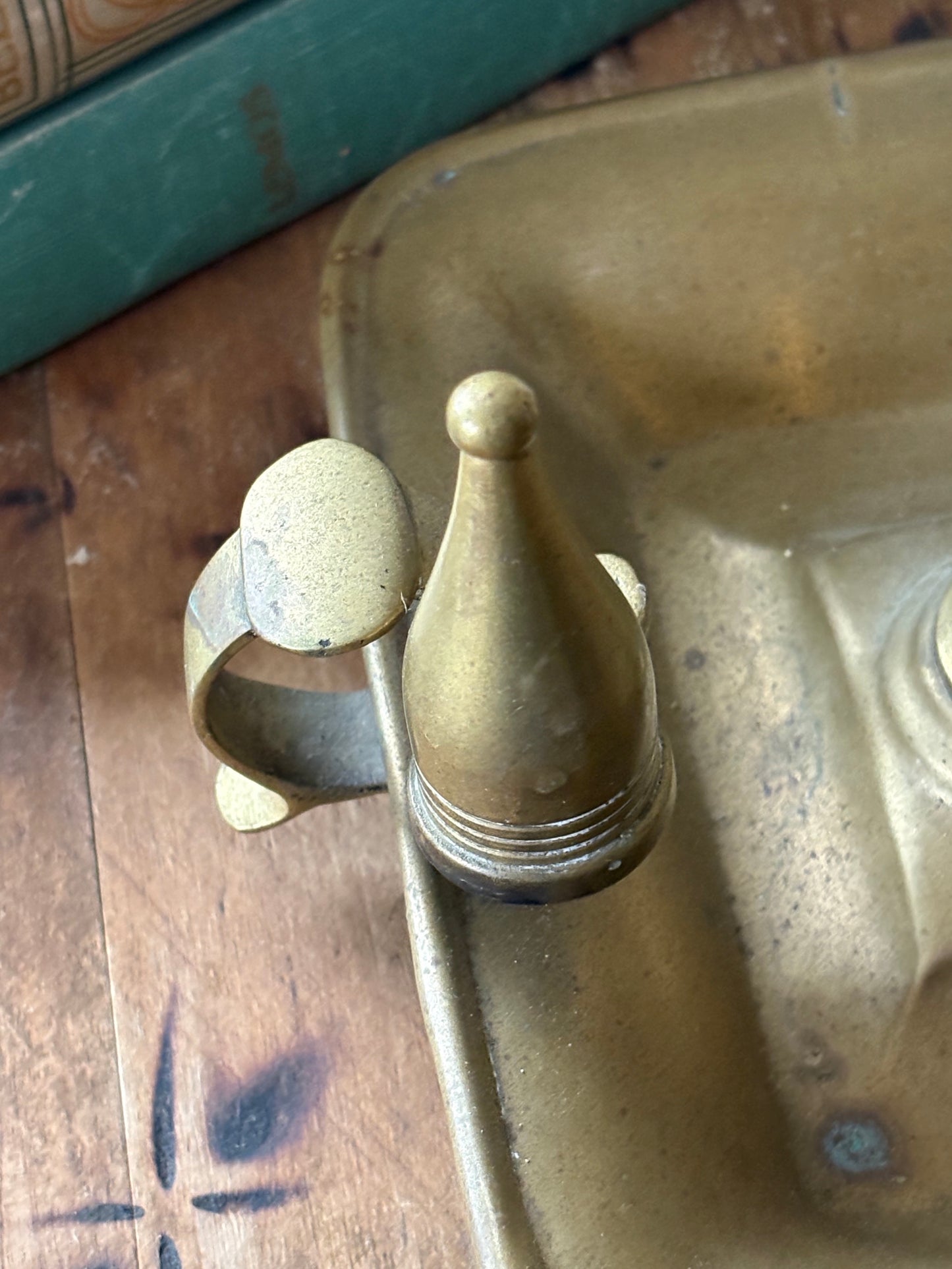 antique brass chamberstick-style candleholder with douter