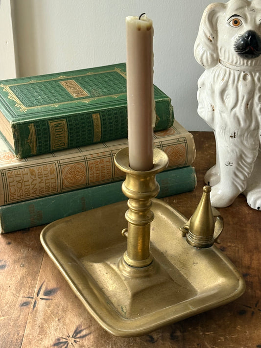 antique brass chamberstick-style candleholder with douter