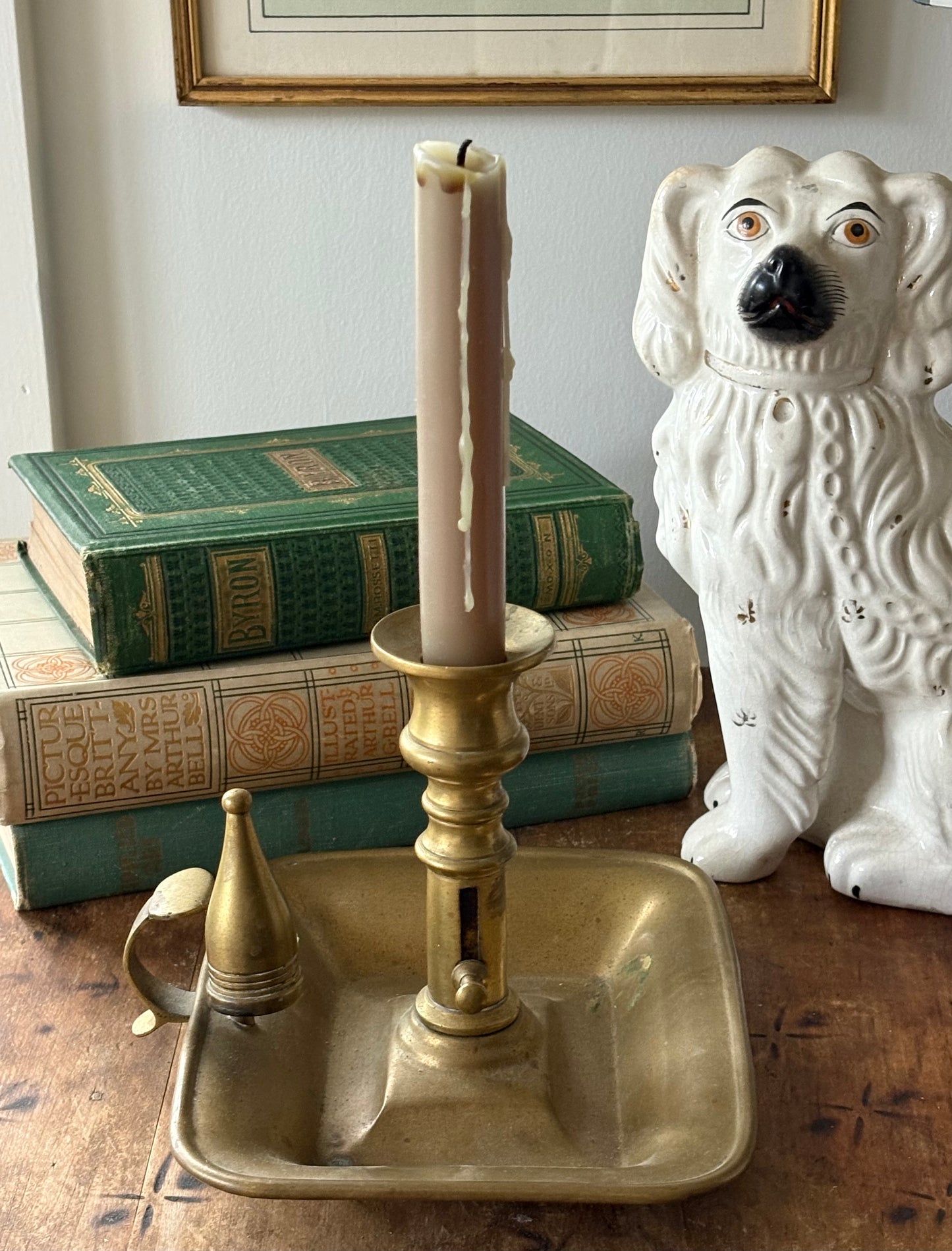 antique brass chamberstick-style candleholder with douter