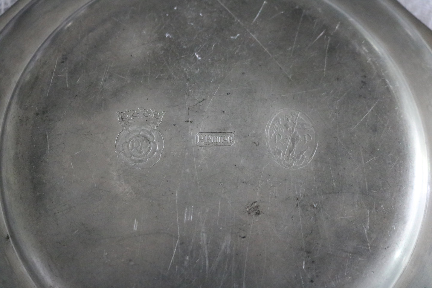 antique Belgian pewter plate made by Robert Pompe