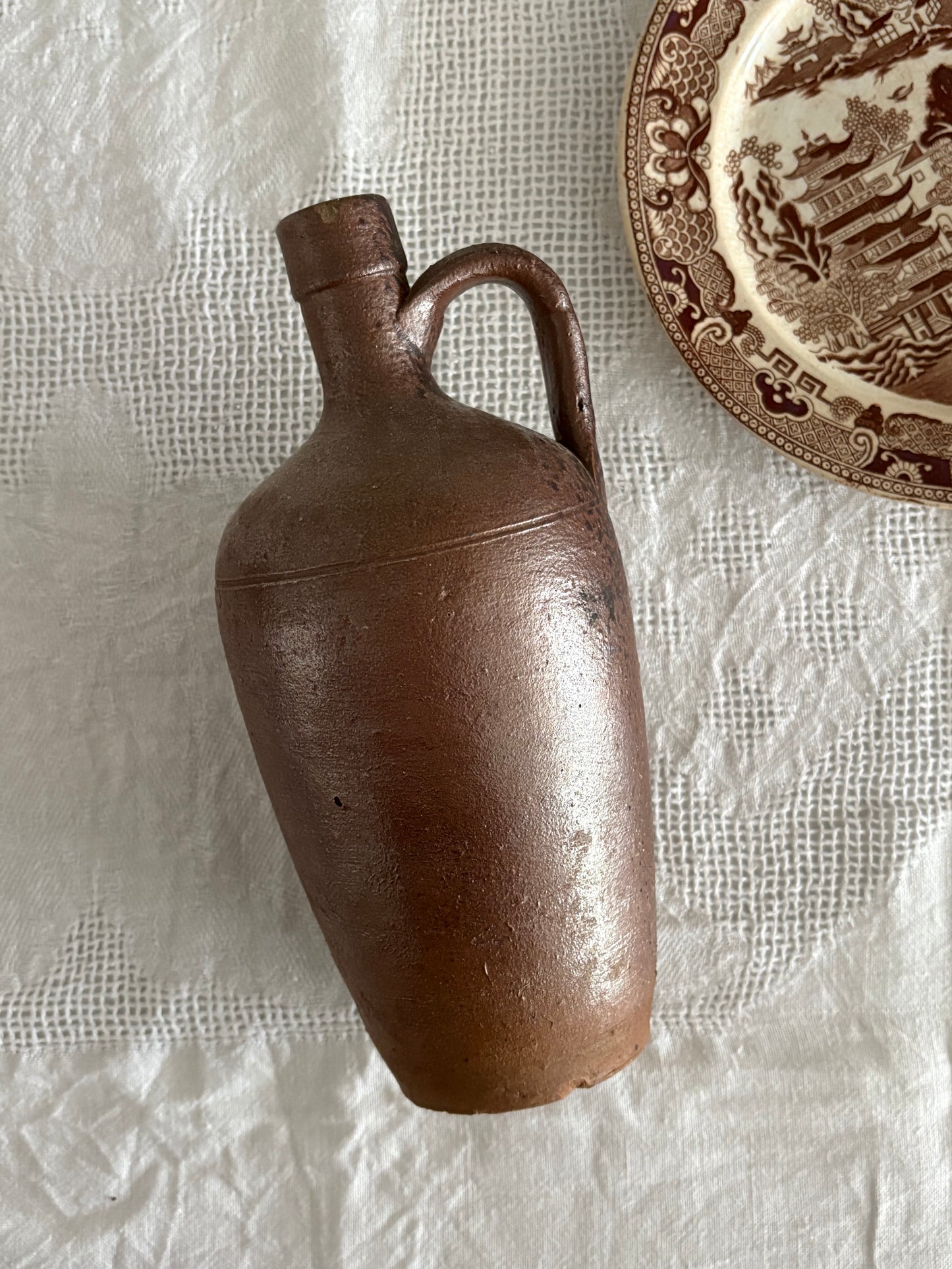 antique brown earthenware jug